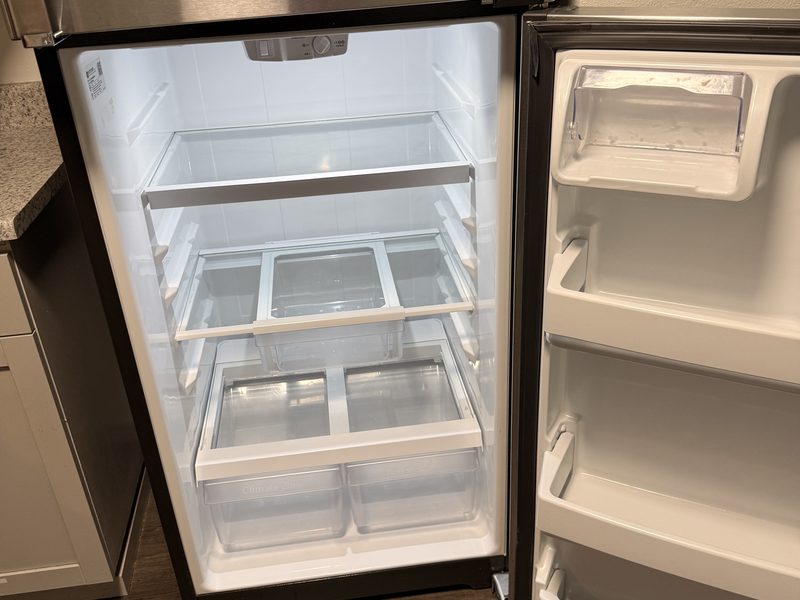 Refrigerator interior cleaned during a move-in clean by Ultimate Cleaning Service