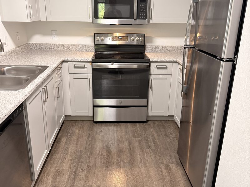 Empty rental kitchen after a move-out clean by Ultimate Cleaning Service